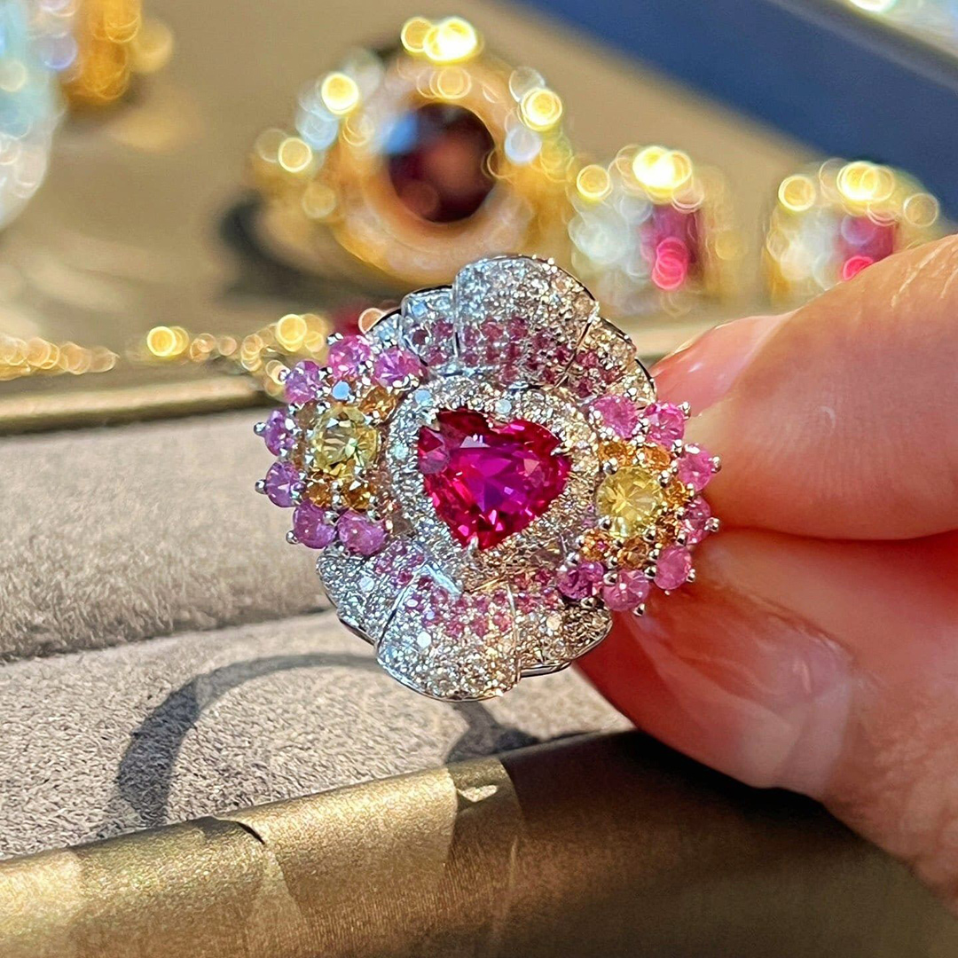 Custom Heart-Shaped Pink Center Stone Ring With Intricate Colored Gemstone Design Halo Deposit